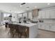 Modern kitchen with island, stainless steel appliances, and white cabinetry at 205 W Blue Ridge Way, Chandler, AZ 85248