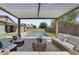 Relaxing patio furniture under a pergola, near the pool at 205 W Blue Ridge Way, Chandler, AZ 85248