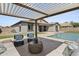 Covered patio with comfortable seating and pergola at 205 W Blue Ridge Way, Chandler, AZ 85248