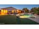 Spacious backyard with a pool, spa, and artificial turf at 21705 N Black Bear Lodge Dr, Surprise, AZ 85387