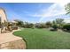 Spacious backyard with artificial turf, pool and hot tub at 21705 N Black Bear Lodge Dr, Surprise, AZ 85387