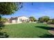 Large backyard with artificial turf and a pool at 21705 N Black Bear Lodge Dr, Surprise, AZ 85387