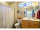 Clean bathroom with shower/tub combo, toilet, and wood vanity at 21705 N Black Bear Lodge Dr, Surprise, AZ 85387