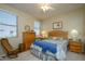 Guest bedroom with queen bed, ceiling fan, and ample closet space at 21705 N Black Bear Lodge Dr, Surprise, AZ 85387