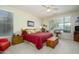 Main bedroom with king-size bed, ceiling fan and ample natural light at 21705 N Black Bear Lodge Dr, Surprise, AZ 85387