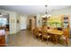 Formal dining room with wood table and chairs, near entryway at 21705 N Black Bear Lodge Dr, Surprise, AZ 85387