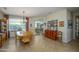 Bright dining room with a wooden table and access to the living area at 21705 N Black Bear Lodge Dr, Surprise, AZ 85387