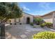 Front view of single story home with landscaped yard at 21705 N Black Bear Lodge Dr, Surprise, AZ 85387