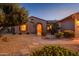 Charming home exterior with arched entryway at 21705 N Black Bear Lodge Dr, Surprise, AZ 85387