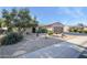 Single-story home with a two-car garage and desert landscaping at 21705 N Black Bear Lodge Dr, Surprise, AZ 85387