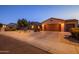 Two-car garage and attractive curb appeal at 21705 N Black Bear Lodge Dr, Surprise, AZ 85387