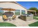 Relaxing hot tub on patio with adjacent seating at 21705 N Black Bear Lodge Dr, Surprise, AZ 85387