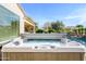 Hot tub with cover, ready for relaxation near the pool at 21705 N Black Bear Lodge Dr, Surprise, AZ 85387