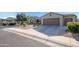 Single story house with two car garage and desert landscaping at 21705 N Black Bear Lodge Dr, Surprise, AZ 85387