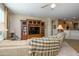 Relaxing living room with sectional sofa and views of the kitchen at 21705 N Black Bear Lodge Dr, Surprise, AZ 85387