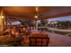 Relaxing covered patio with seating area, adjacent to a sparkling pool at 21705 N Black Bear Lodge Dr, Surprise, AZ 85387