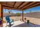 Relaxing backyard with a covered patio, gravel landscaping, and a bocce ball court at 2235 W Villa Rita Dr, Phoenix, AZ 85023