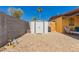 Clean backyard featuring storage shed, gate, and rock landscaping at 2235 W Villa Rita Dr, Phoenix, AZ 85023