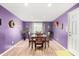 Purple dining room with dark wood table and chairs at 2235 W Villa Rita Dr, Phoenix, AZ 85023