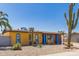 Charming yellow single-story home with gravel landscaping, saguaro cacti, and bright blue trim around windows and pillars at 2235 W Villa Rita Dr, Phoenix, AZ 85023