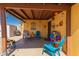 Charming covered patio with colorful furniture and decorative accents at 2235 W Villa Rita Dr, Phoenix, AZ 85023