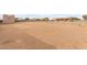 Large sandy backyard with barn and fencing at 22605 W Baker Dr, Wittmann, AZ 85361