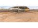 Metal-roofed barn with stalls, ideal for horses at 22605 W Baker Dr, Wittmann, AZ 85361