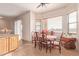 Charming dining room with wood table and chairs near kitchen at 22605 W Baker Dr, Wittmann, AZ 85361