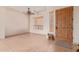 Tile entryway with ceiling fan and wooden door at 22605 W Baker Dr, Wittmann, AZ 85361