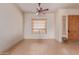 Tile entryway with ceiling fan and view into the living area at 22605 W Baker Dr, Wittmann, AZ 85361