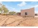 Stucco home with a stone pathway and desert landscaping at 22605 W Baker Dr, Wittmann, AZ 85361