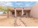 Tuscan style home with a wooden front door and stone pathway at 22605 W Baker Dr, Wittmann, AZ 85361