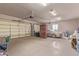 Garage with overhead door and ample storage space at 22605 W Baker Dr, Wittmann, AZ 85361