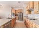 Spacious kitchen with wood cabinets and granite countertops at 22605 W Baker Dr, Wittmann, AZ 85361