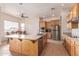 Modern kitchen with granite island and stainless steel appliances at 22605 W Baker Dr, Wittmann, AZ 85361