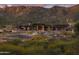 Community clubhouse nestled in mountains with a scenic backdrop and ample parking at 23491 N 125Th Pl, Scottsdale, AZ 85255