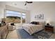 Main bedroom with large windows and ceiling fan at 23491 N 125Th Pl, Scottsdale, AZ 85255