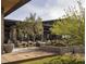 Outdoor patio area with seating and desert landscaping at 23491 N 125Th Pl, Scottsdale, AZ 85255