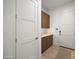 Bright entryway with built-in storage and wood flooring at 23491 N 125Th Pl, Scottsdale, AZ 85255