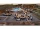 Resort-style pool area with a fire pit and lounge seating at 23491 N 125Th Pl, Scottsdale, AZ 85255