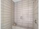 Walk-in shower with built-in seat and modern tile at 23491 N 125Th Pl, Scottsdale, AZ 85255