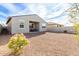 Spacious backyard with gravel and a view of the house at 25412 N 144Th Dr, Surprise, AZ 85387