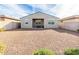 Large backyard with gravel landscaping and a view of the house at 25412 N 144Th Dr, Surprise, AZ 85387