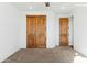 Spacious bedroom with double doors and carpeted floor at 274 E Mckellips Blvd, Apache Junction, AZ 85119