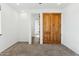 Bedroom with wood doors and carpeted floor at 274 E Mckellips Blvd, Apache Junction, AZ 85119