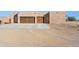 Three-car garage with rustic metal doors at 274 E Mckellips Blvd, Apache Junction, AZ 85119