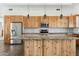 Modern kitchen with light wood cabinets and granite island at 274 E Mckellips Blvd, Apache Junction, AZ 85119