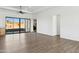 Bright living room with sliding glass doors and wood-look floors at 274 E Mckellips Blvd, Apache Junction, AZ 85119