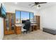 Home office with built-in desk and abundant natural light at 274 E Mckellips Blvd, Apache Junction, AZ 85119