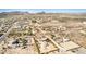 Aerial view of a residential area with houses, pool, and desert landscape at 27511 N 33Rd Ave, Phoenix, AZ 85083